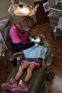 dentist works on child patient