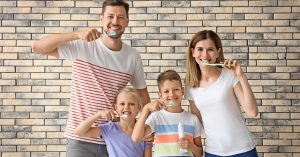 a family takes pride in their oral health thanks to family dentistry and dental sealants