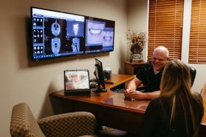 Dr. Yenchesky puts on a friendly, caring smile during a patient consultation.